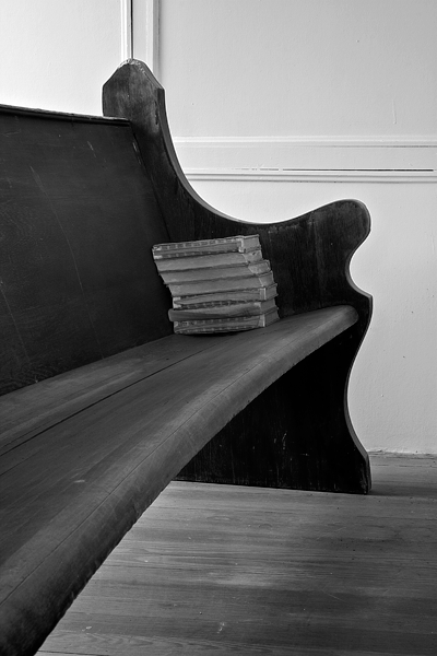 Hymnals On A Pew